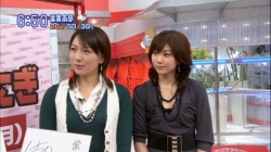 Kumiko Ogura and badminton partner Reiko Shiota in a TV interview.