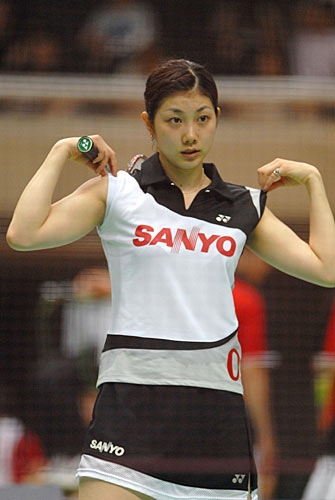 Reiko Shiota adjusting badminton outfit.