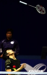 Wang Lin tossing her racket