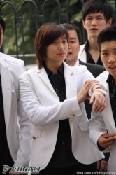 Wang Lin in a white suit.