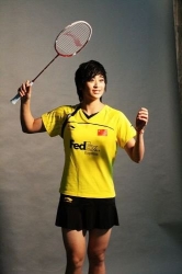Studio shot of Wang Lin in badminton uniform and Li-Ning racket.