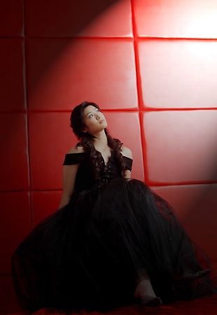 Studio shot of Wang Lin in a black dress.