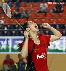 Wang Shixian screams in celebration after defeating Wang Xin in the women's singles final at Malaysia